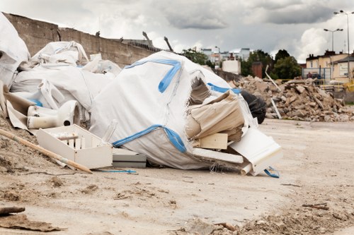 Workers managing construction debris for clearance